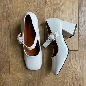 Gem buckle block heels.